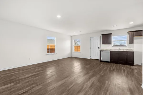 a view of a kitchen with a sink and a large window