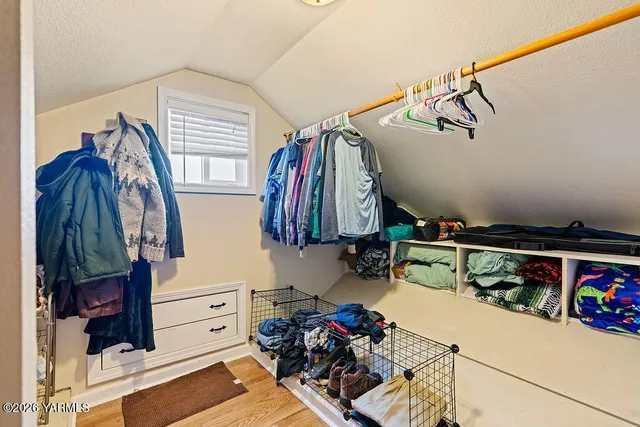 a view of a house with a yard and mountains