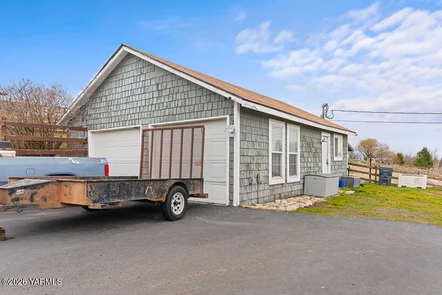 a view of a lake with a house in the background