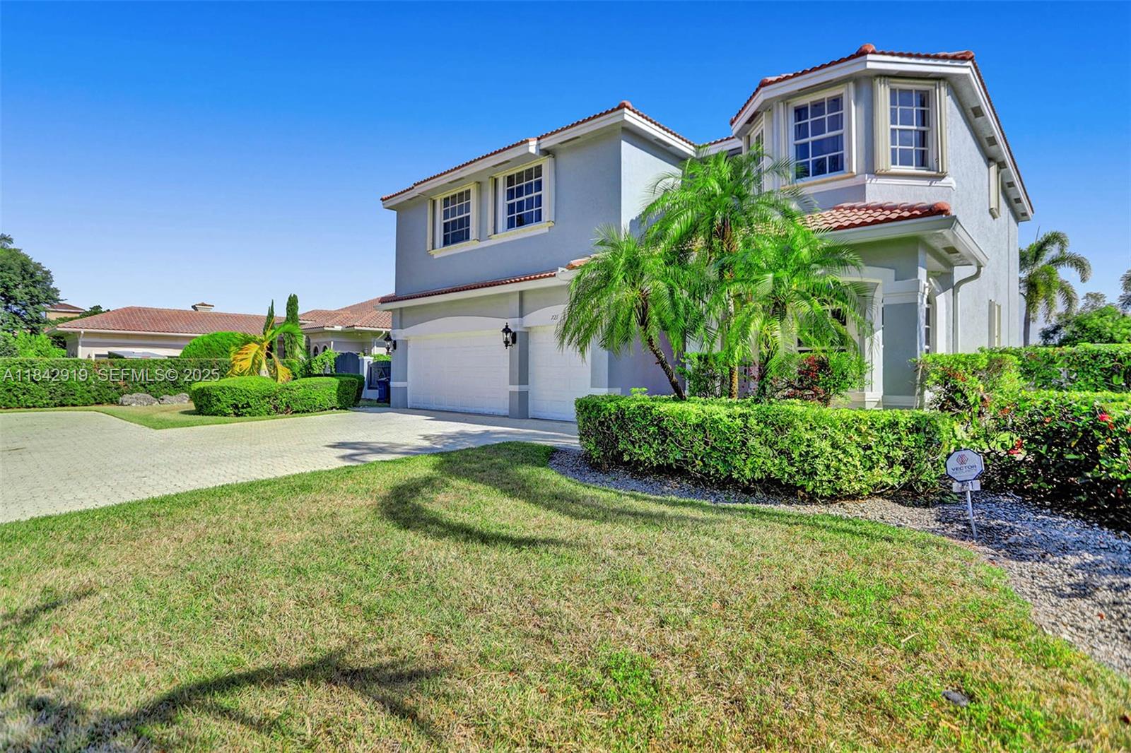 721 Ranch Road Weston, FL 33326 - Photo 2 of 38 a front view of a house with a yard