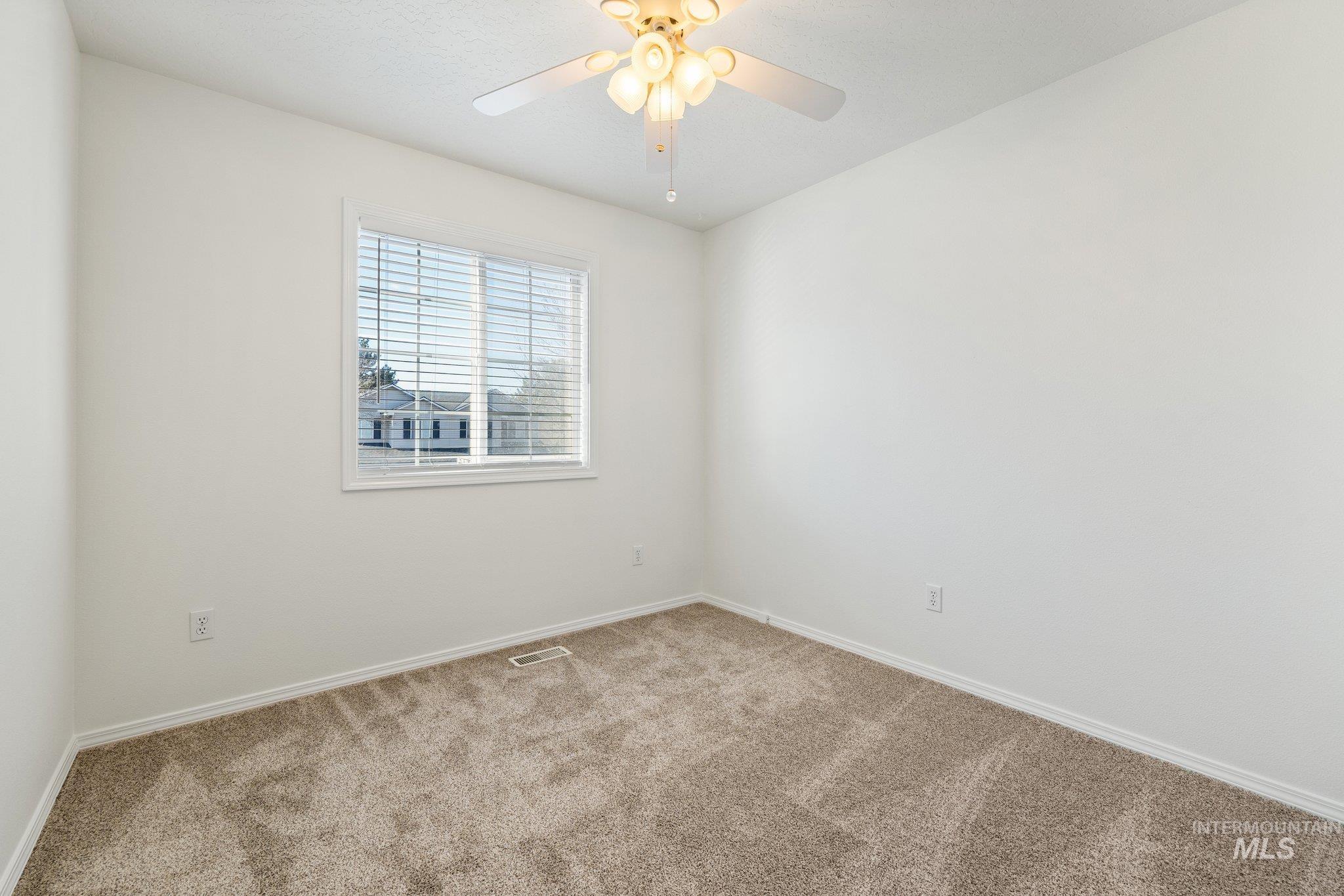 2900 South Ladera Place Boise, ID 83705 - Photo 24 of 31 Unfurnished room featuring carpet and ceiling fan
