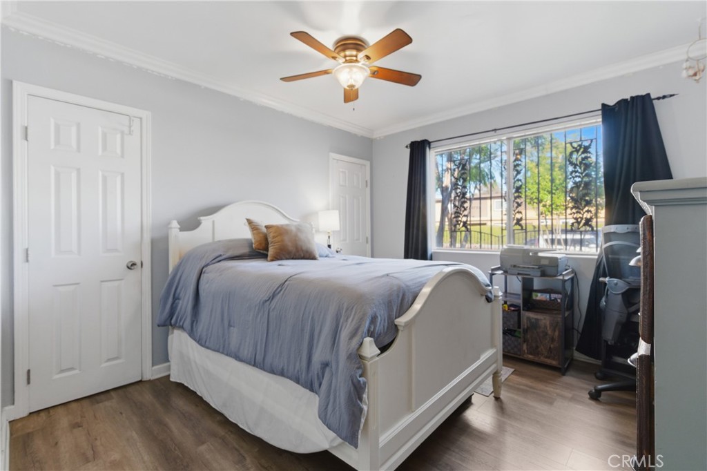 10731 Wright Road South Gate, CA 90280 - Photo 13 of 35 a bedroom with a bed and a large window
