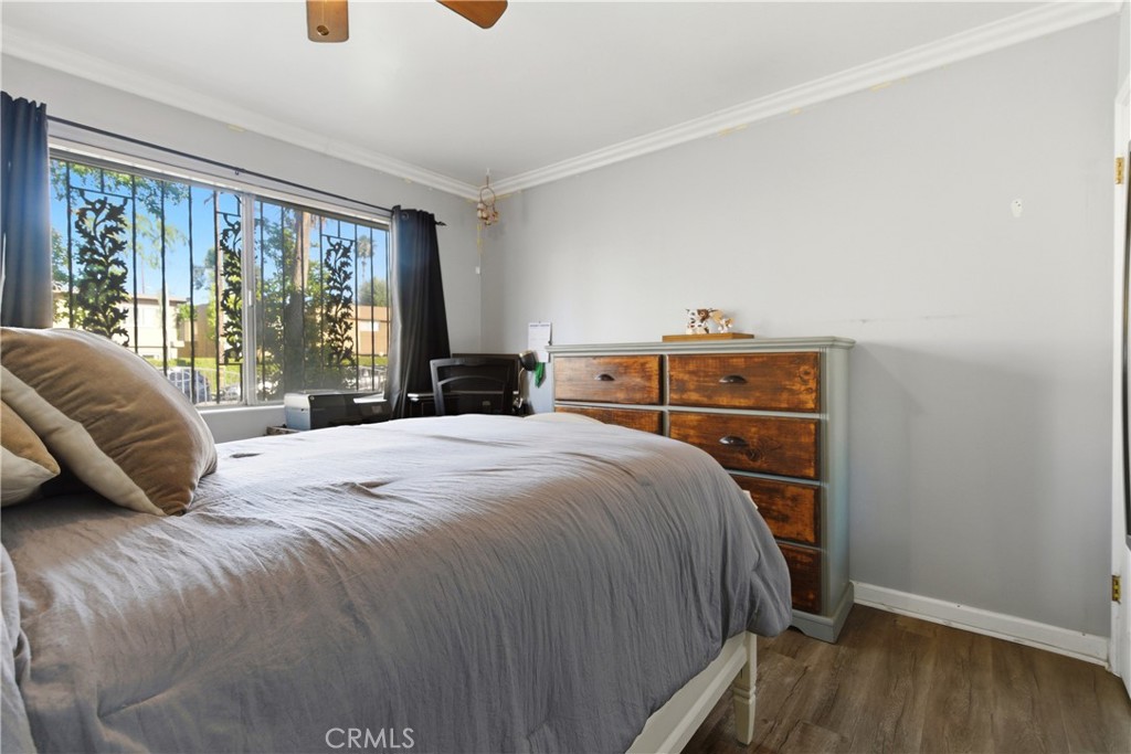 10731 Wright Road South Gate, CA 90280 - Photo 14 of 35 a bed sitting in a bedroom next to a window