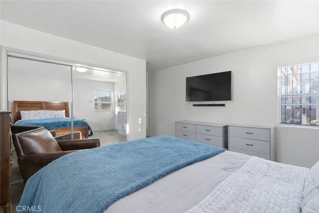 10731 Wright Road South Gate, CA 90280 - Photo 18 of 35 a bedroom with a bed and a flat screen tv