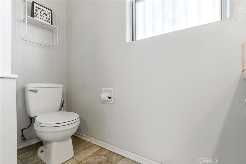 10731 Wright Road South Gate, CA 90280 - Photo 23 of 35 a bathroom with a toilet and a sink