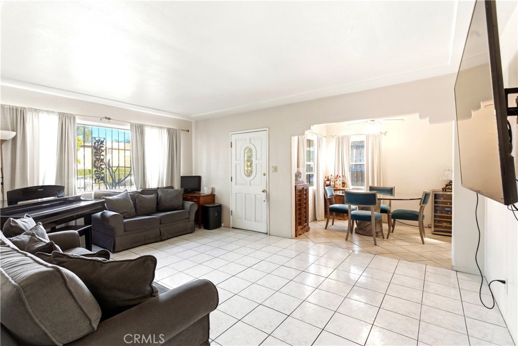 10731 Wright Road South Gate, CA 90280 - Photo 5 of 35 a living room with furniture and a large window