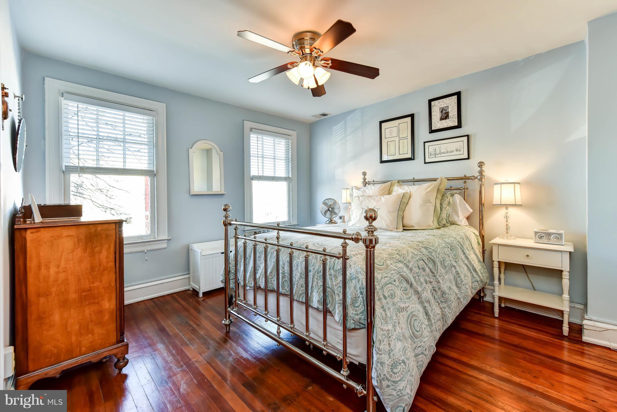 637 E Street Northeast Washington, DC 20002 - Photo 17 of 29 a bedroom with a bed and a chandelier