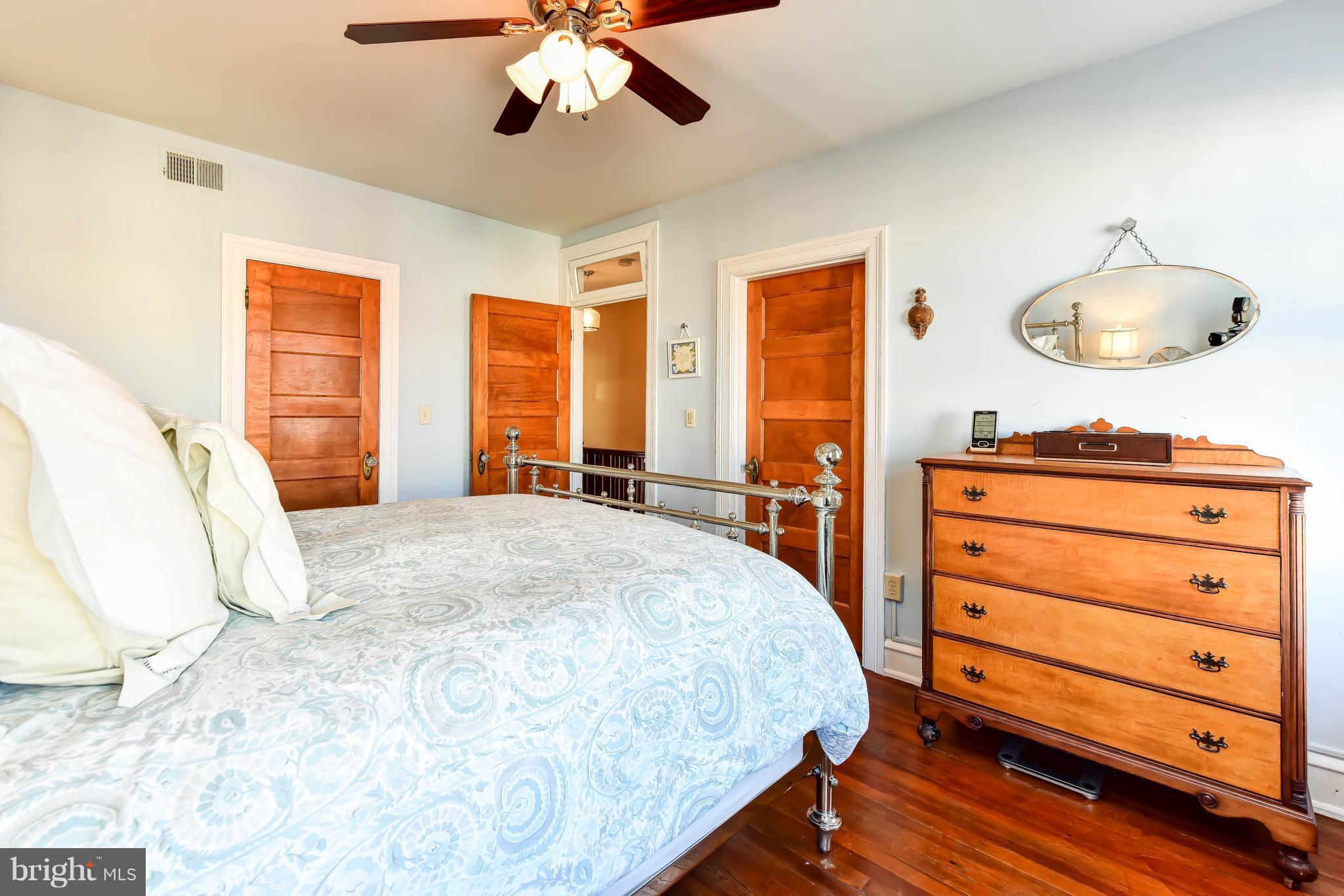 637 E Street Northeast Washington, DC 20002 - Photo 18 of 29 a bedroom with a bed and a chandelier