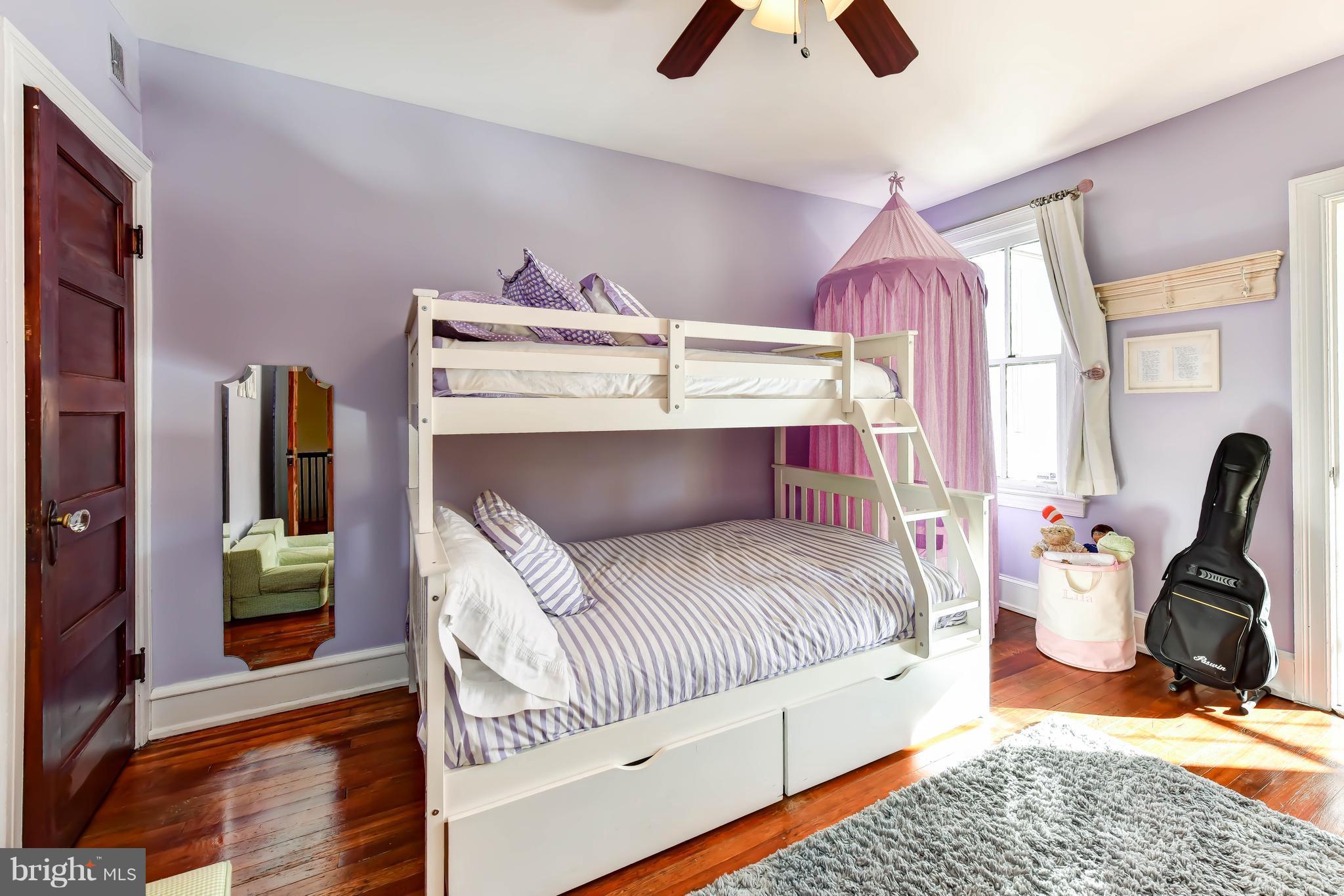 637 E Street Northeast Washington, DC 20002 - Photo 22 of 29 a bedroom with a bed and a chandelier