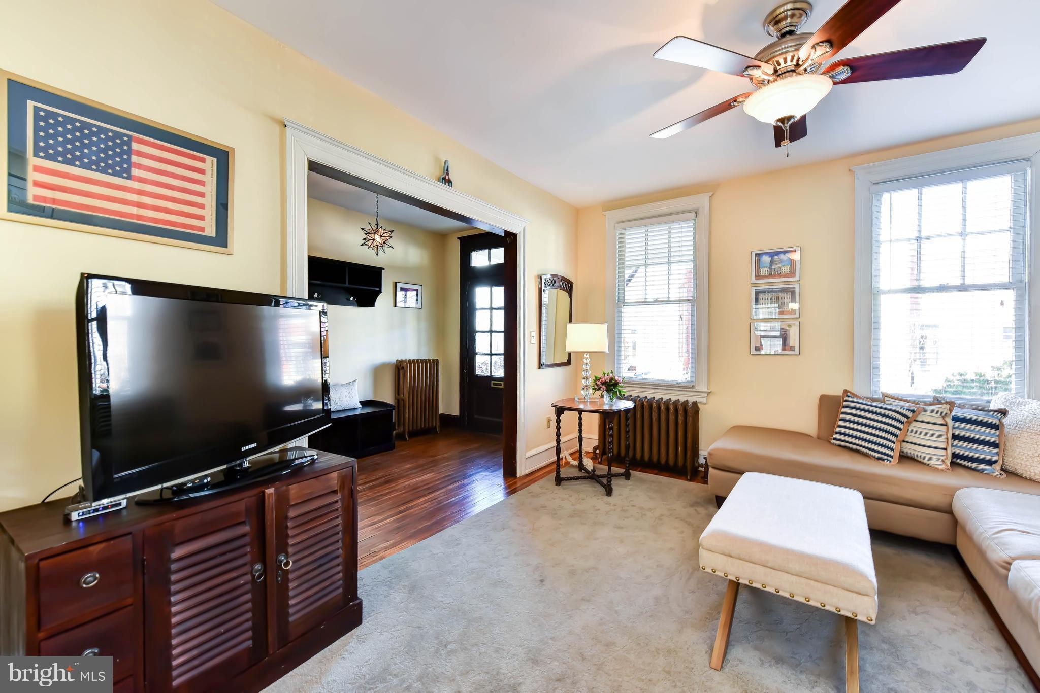 637 E Street Northeast Washington, DC 20002 - Photo 7 of 29 a living room with furniture and a flat screen tv