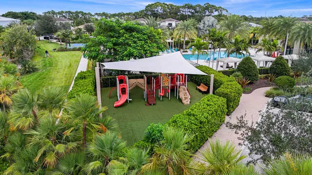 an aerial view of a house with pool yard and outdoor seating