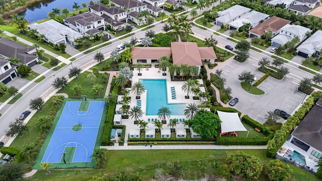 an aerial view of multiple houses with yard