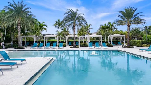 a view of house with swimming pool and a couch