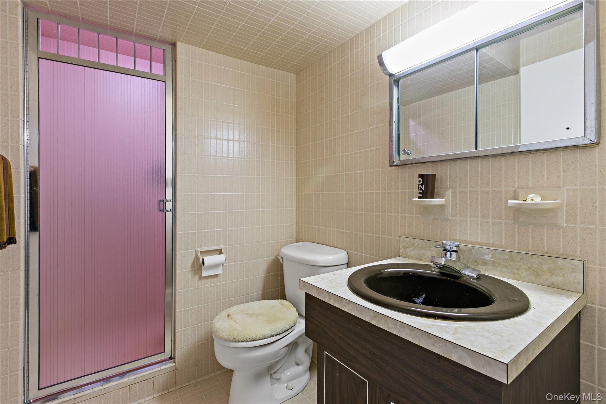 16 Meadow Road Scarsdale, NY 10583 - Photo 31 of 47 a bathroom with a sink a toilet and a mirror
