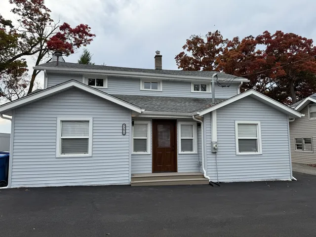 a view of a house next to a yard