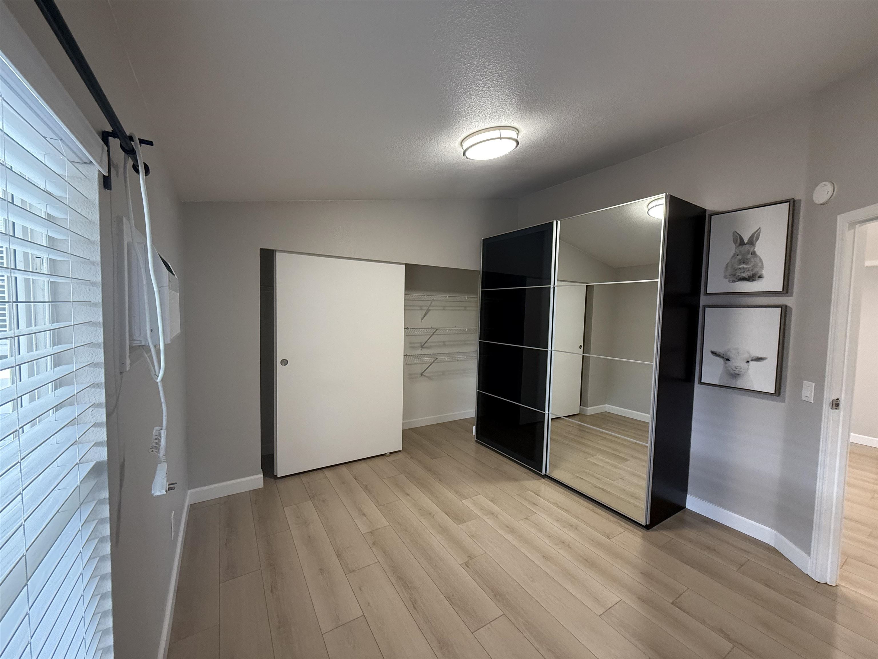 2151 Oakland Road, Unit 232 San Jose, CA 95131 - Photo 12 of 17 a view of empty room with wooden floor and electronic appliances