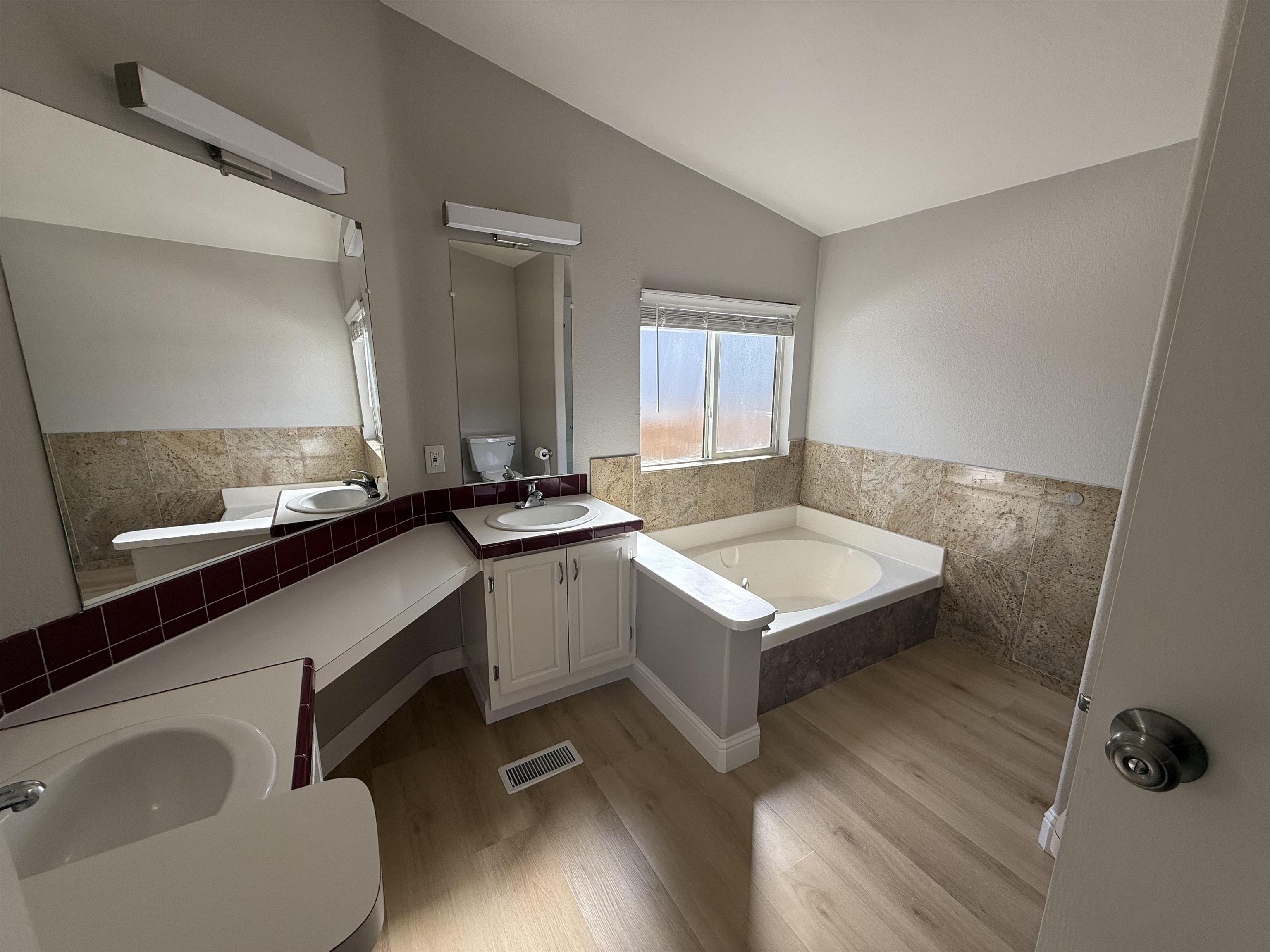 2151 Oakland Road, Unit 232 San Jose, CA 95131 - Photo 16 of 17 a living room with granite countertop furniture a sink and a window