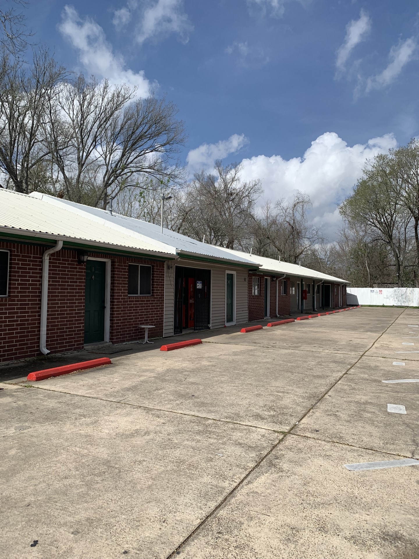 4831 Sycamore Avenue, Unit 10 Pasadena, TX 77503 - Photo 1 of 12 a front view of a house with a yard