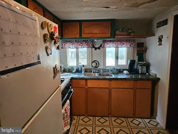 a view of a room with window and wooden floor