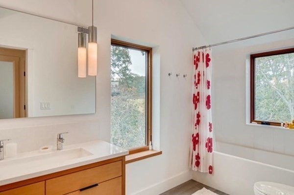 15 Loon Lane Chilmark, MA 02535 - Photo 15 of 29 a bathroom with a sink a bath tub and a window