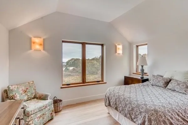 a bedroom with a bed and window