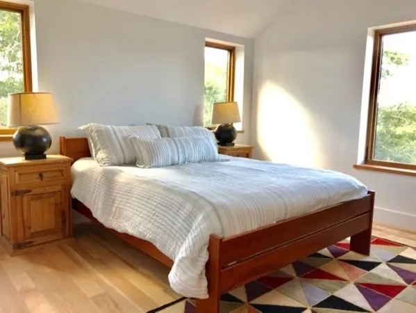 a bedroom with bed and window