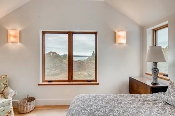 a bedroom with bed and a window