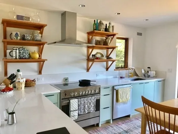 a kitchen with stainless steel appliances granite countertop a sink stove and cabinets