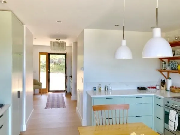 a spacious bathroom with a double vanity sink and a mirror