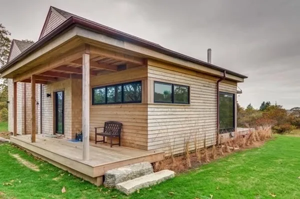 a view of house with backyard