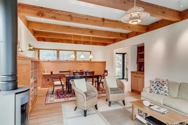 a view of a dining room with furniture and chandelier