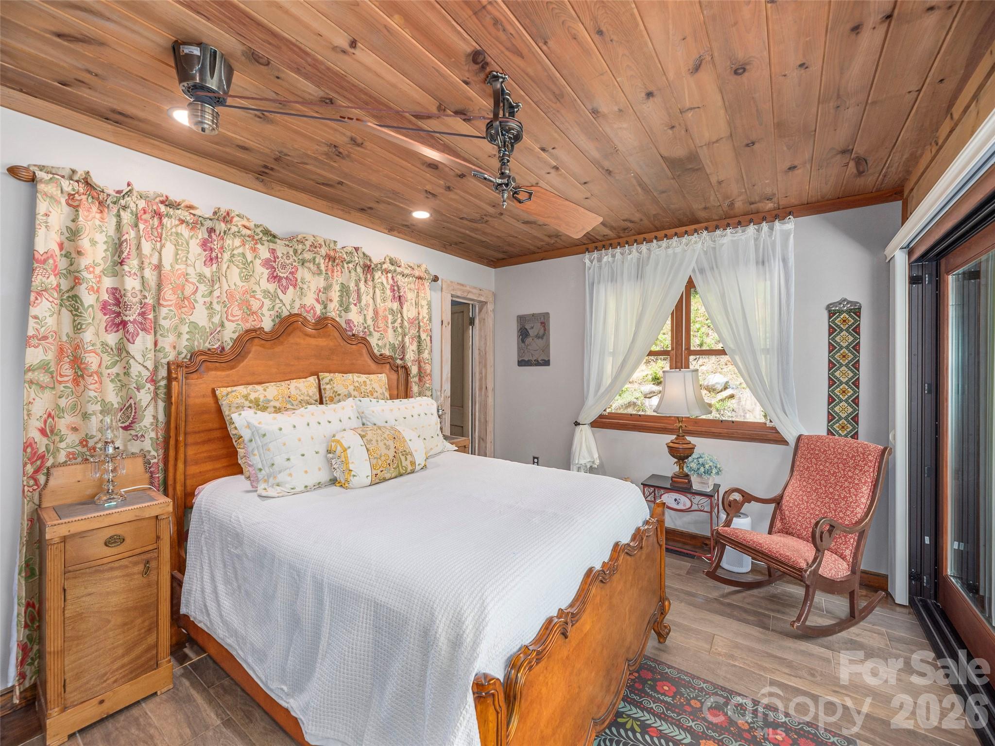 461 Ferguson Cove Loop Clyde, NC 28721 - Photo 21 of 46 a bedroom with furniture and a window