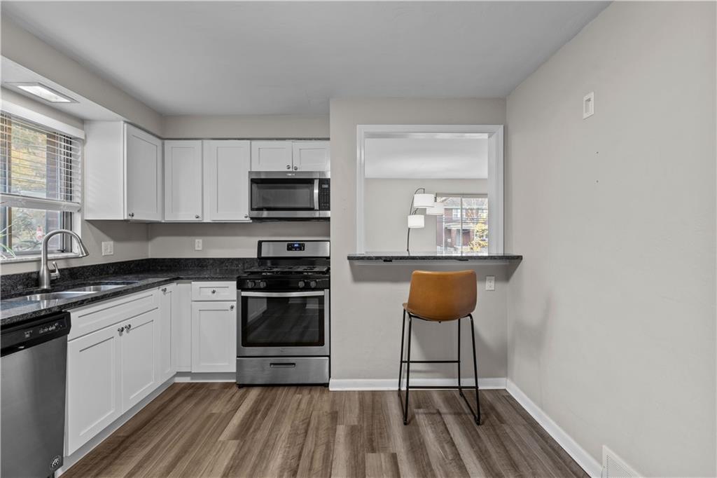 3407 Brighton Road Pittsburgh, PA 15212 - Photo 12 of 27 a kitchen with a sink cabinets and window