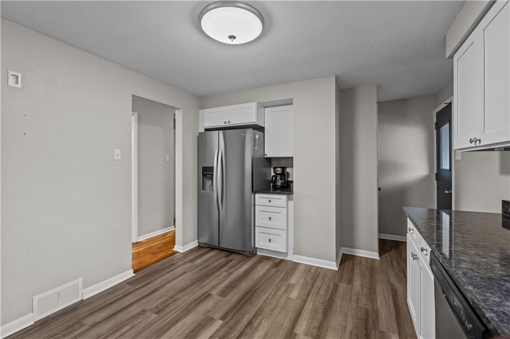 3407 Brighton Road Pittsburgh, PA 15212 - Photo 14 of 27 a view of kitchen with refrigerator stove and wooden cabinets