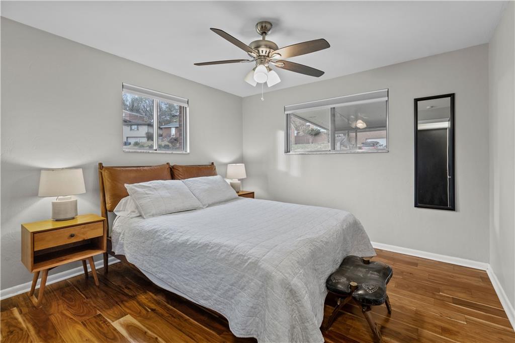 3407 Brighton Road Pittsburgh, PA 15212 - Photo 18 of 27 a bedroom with a bed and a lamp on table
