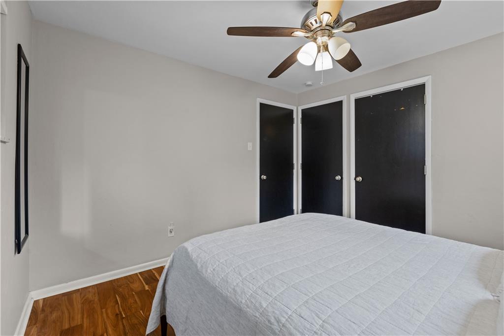 3407 Brighton Road Pittsburgh, PA 15212 - Photo 19 of 27 a bedroom with a bed and a chandelier