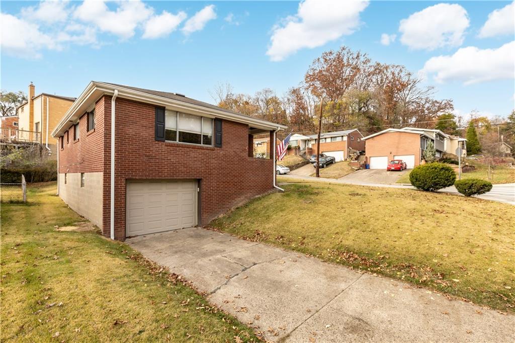 3407 Brighton Road Pittsburgh, PA 15212 - Photo 27 of 27 a yellow house with trees in front of it