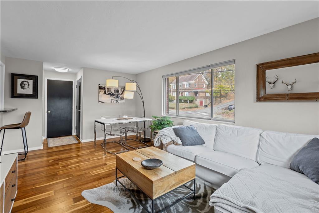 3407 Brighton Road Pittsburgh, PA 15212 - Photo 5 of 27 a living room with furniture and a large window