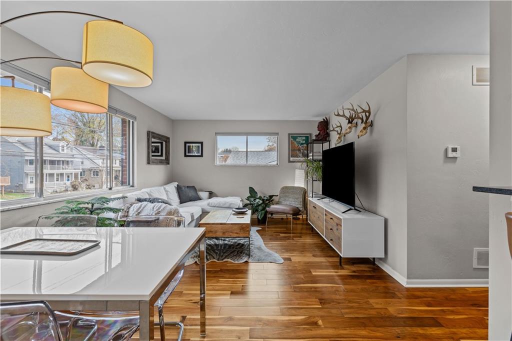 3407 Brighton Road Pittsburgh, PA 15212 - Photo 6 of 27 a living room with furniture and a flat screen tv