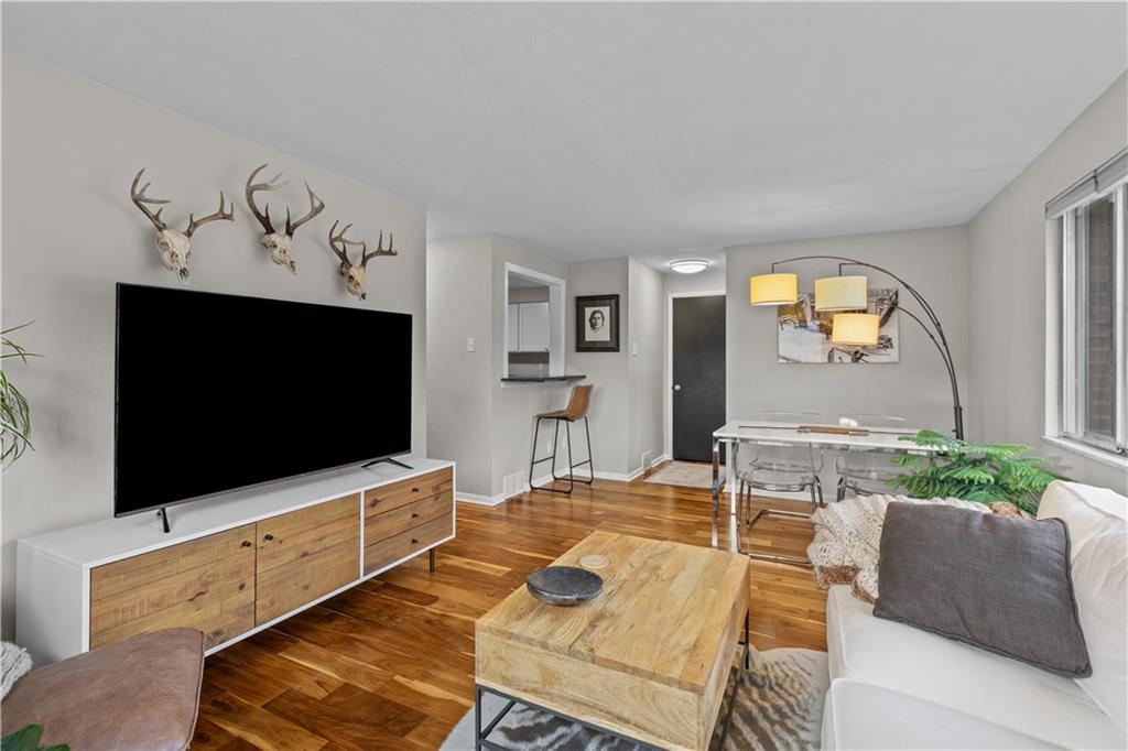 3407 Brighton Road Pittsburgh, PA 15212 - Photo 8 of 27 a living room with furniture and a flat screen tv