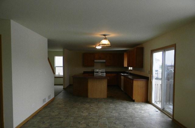 224 Ridgestone Trail Poplar Grove, IL 61065 - Photo 8 of 17 a kitchen with a refrigerator and a sink