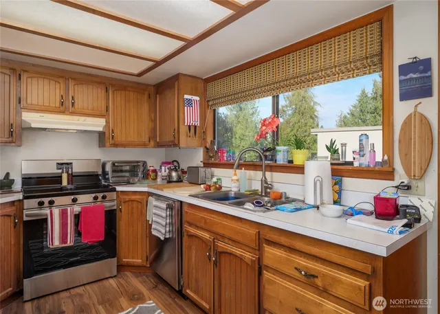 a view of backyard with outdoor seating and green space