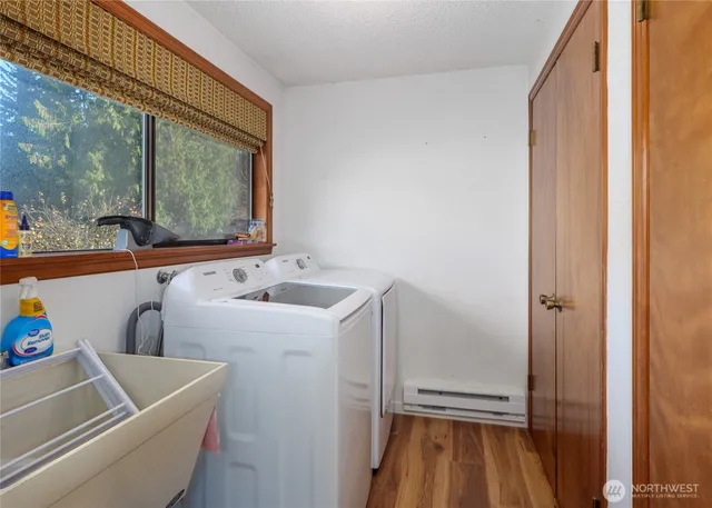 a bedroom with a bed and flat screen tv