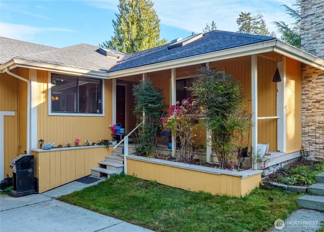 a room with furniture and view of bathroom