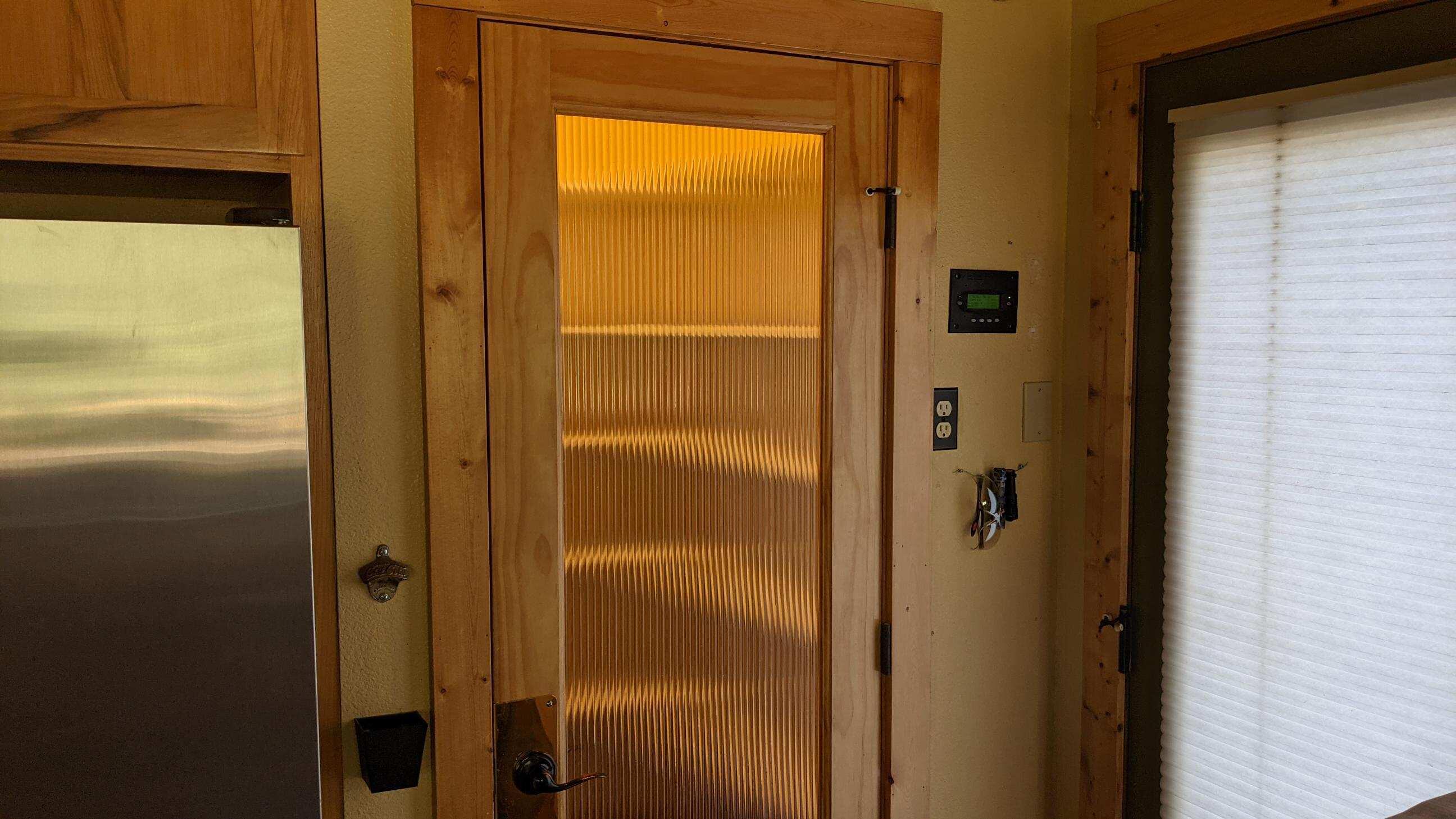 27203 Donkey Mine Road Oak Run, CA 96069 - Photo 12 of 22 a bathroom with a glass shower door