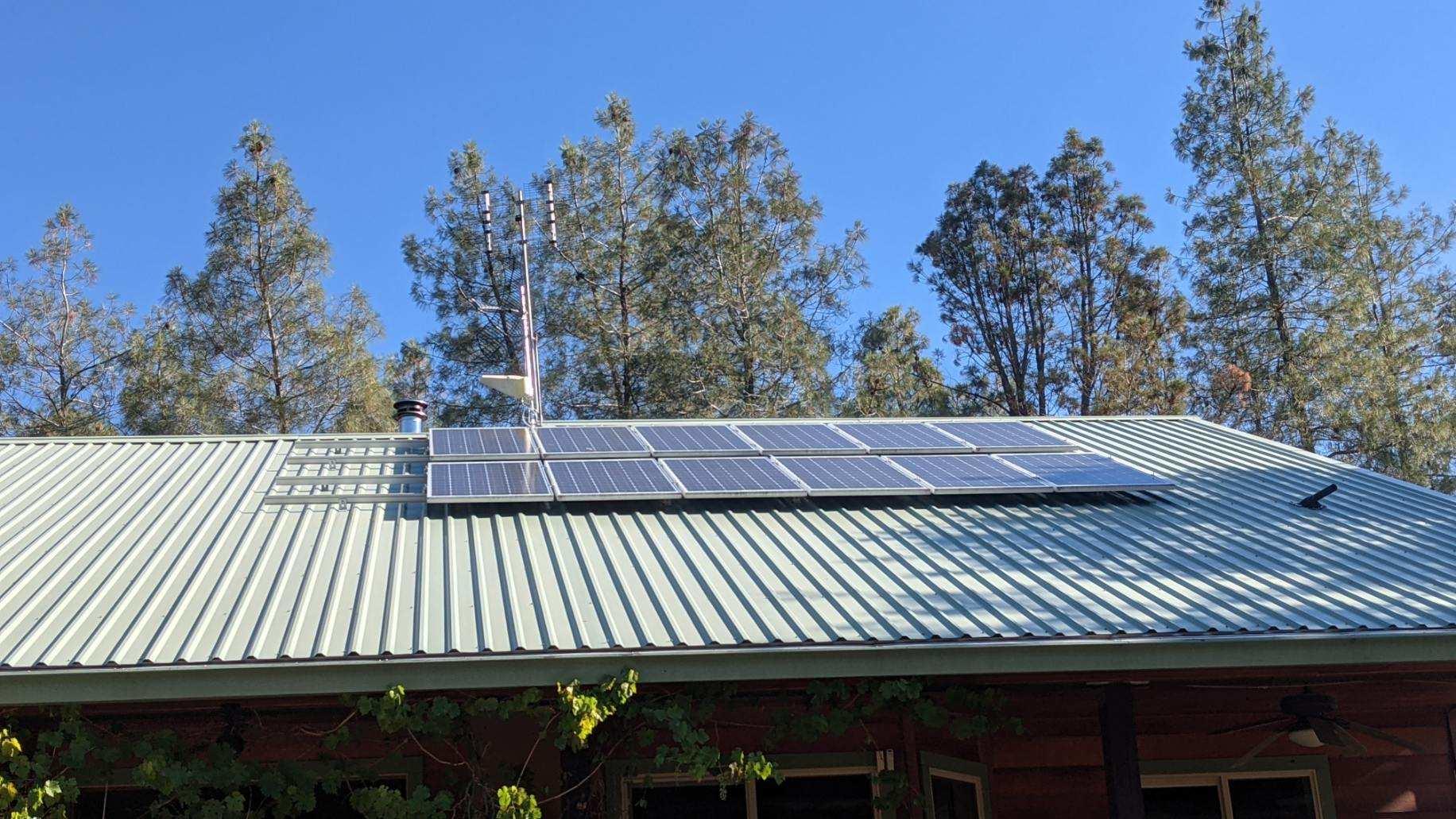 27203 Donkey Mine Road Oak Run, CA 96069 - Photo 17 of 22 a view of a patio with table and chairs a barbeque with wooden floor and fence