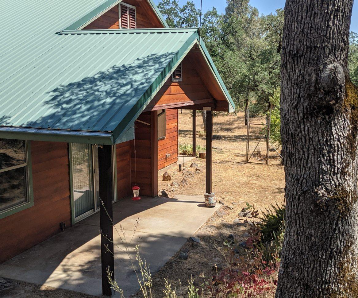 27203 Donkey Mine Road Oak Run, CA 96069 - Photo 21 of 22 a front view of a house with a yard