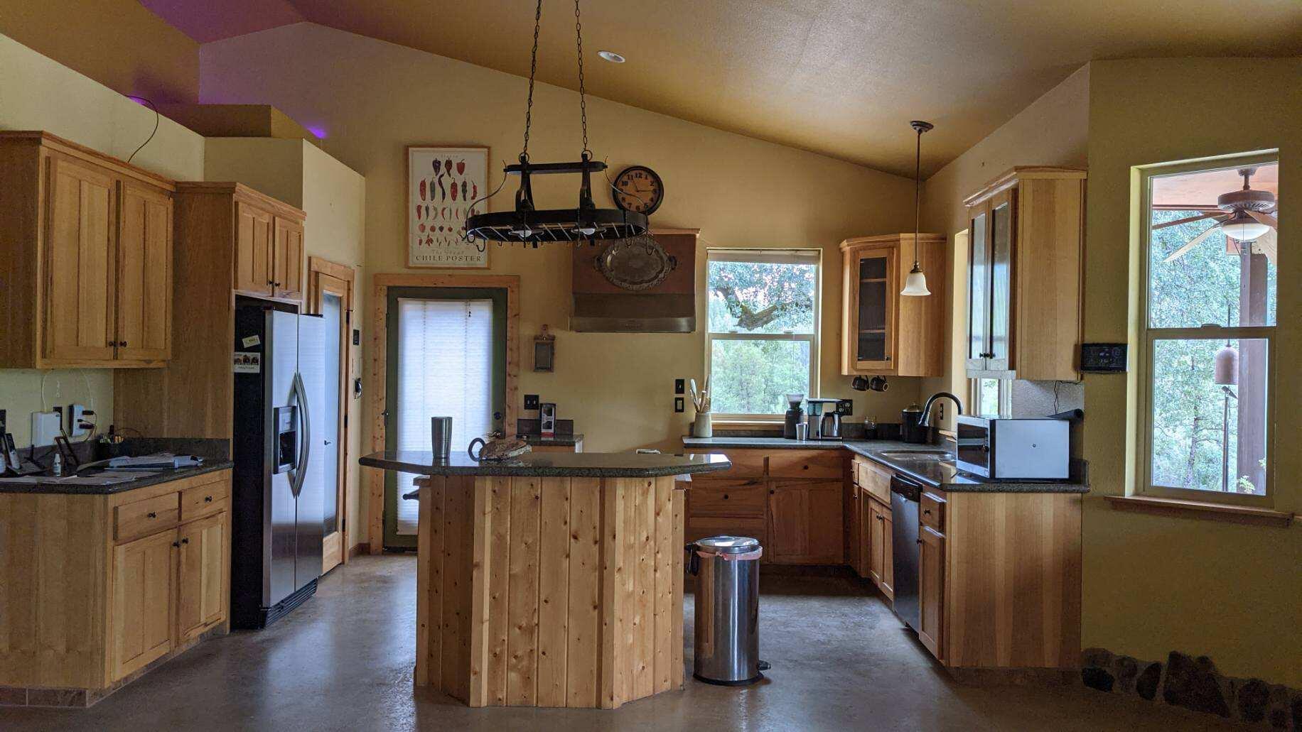 27203 Donkey Mine Road Oak Run, CA 96069 - Photo 5 of 22 a kitchen with granite countertop a sink a counter space appliances and cabinets
