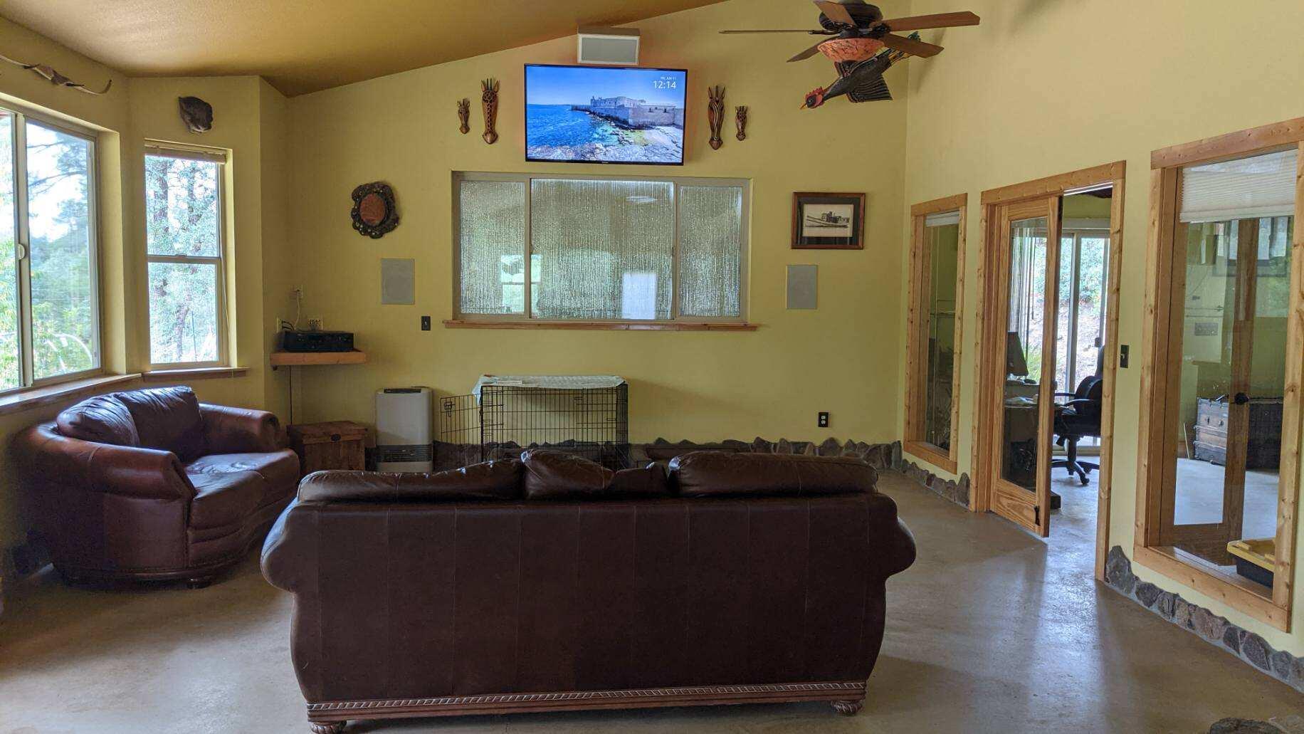 27203 Donkey Mine Road Oak Run, CA 96069 - Photo 6 of 22 a living room with furniture and a flat screen tv