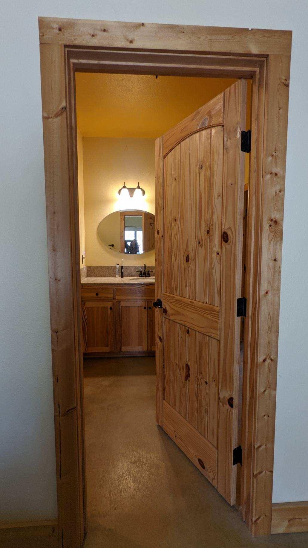 27203 Donkey Mine Road Oak Run, CA 96069 - Photo 10 of 22 a bathroom with a sink a mirror and a shower